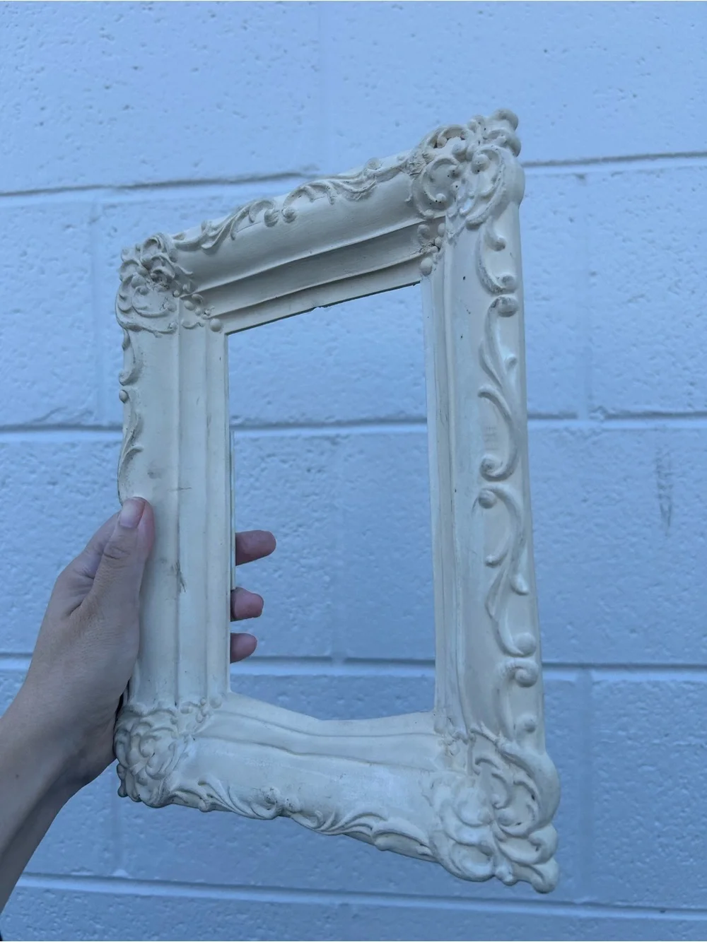 vintage ornate baroque picture frame in an off-white or cream shabby chic